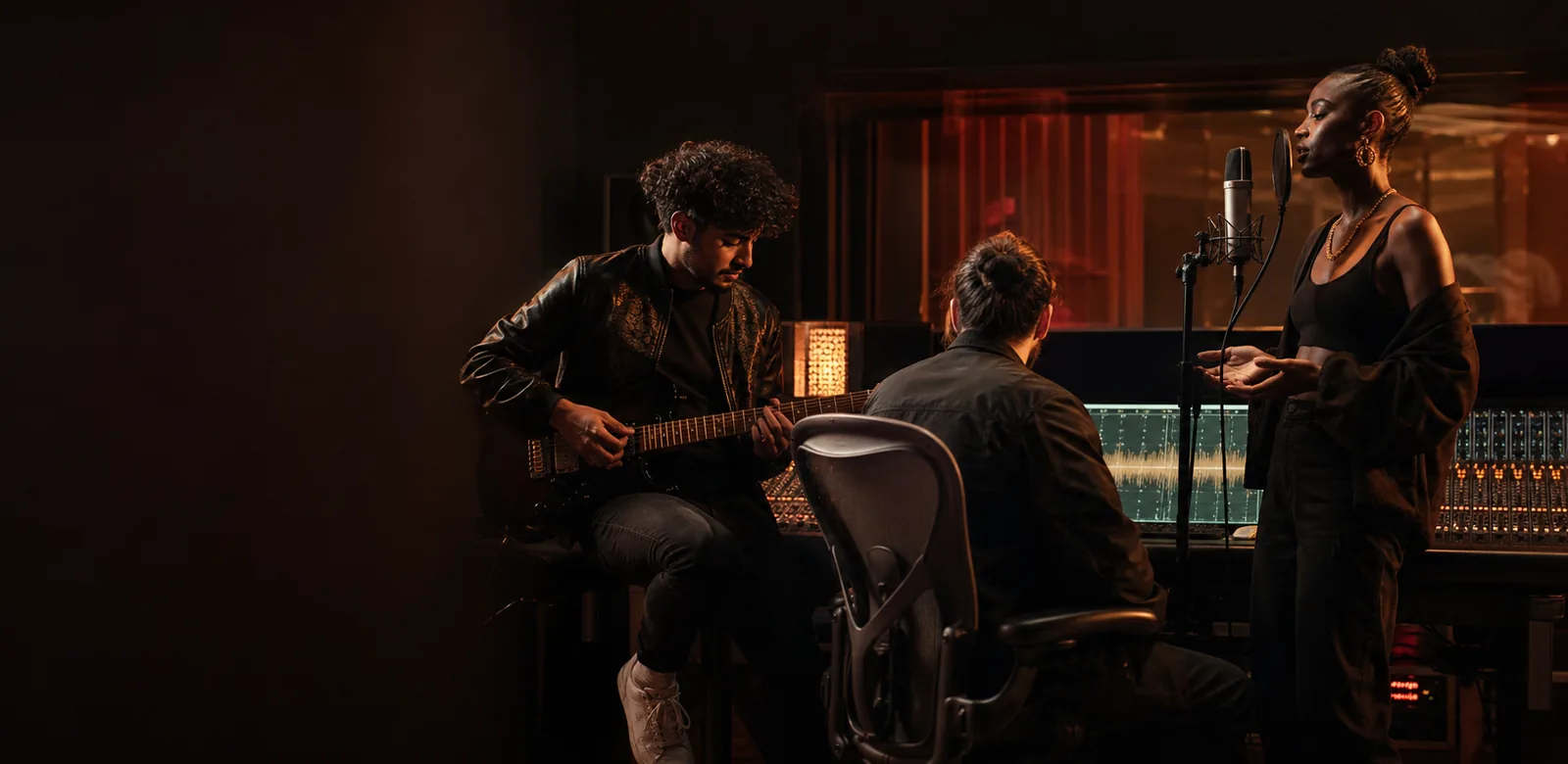 Independent music creators working together in a recording studio